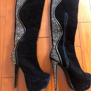 thigh-high boots with gold embellishments